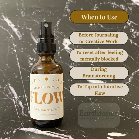 Aromatherapy mist bottle labeled 'Flow' on a textured dark background with usage tips.