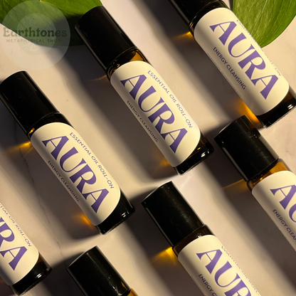 Aura essential oil roll-ons on a neutral background