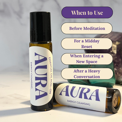 Two 'Aura' essential oil roll-ons with usage tips on a neutral background