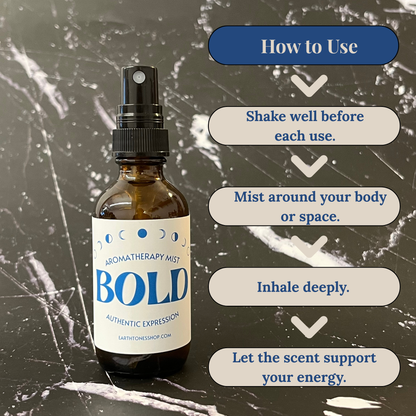 Aromatherapy mist bottle labeled 'BOLD' with usage instructions on a textured background