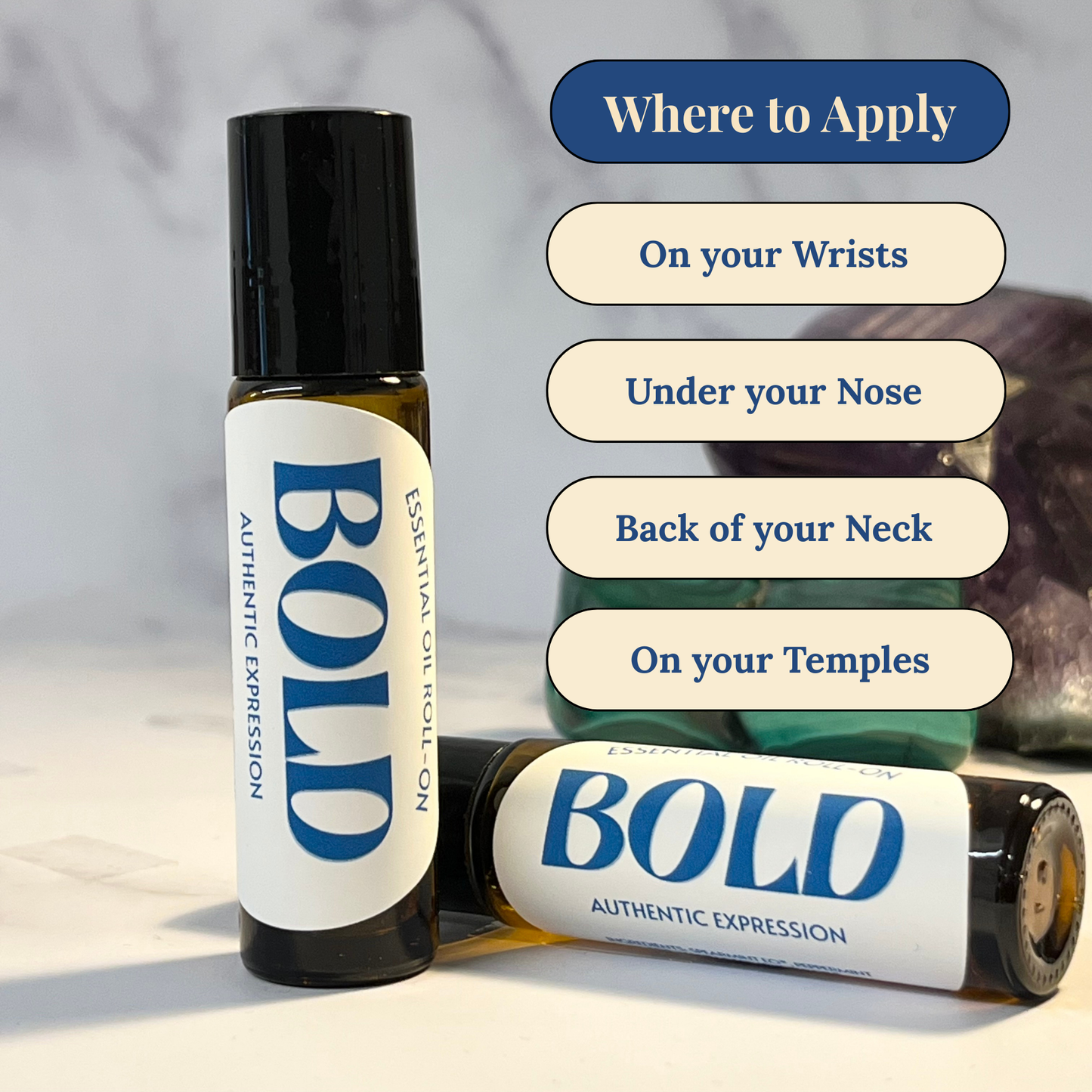 Two 'BOLD' essential oil roller bottles with application instructions on a neutral background.