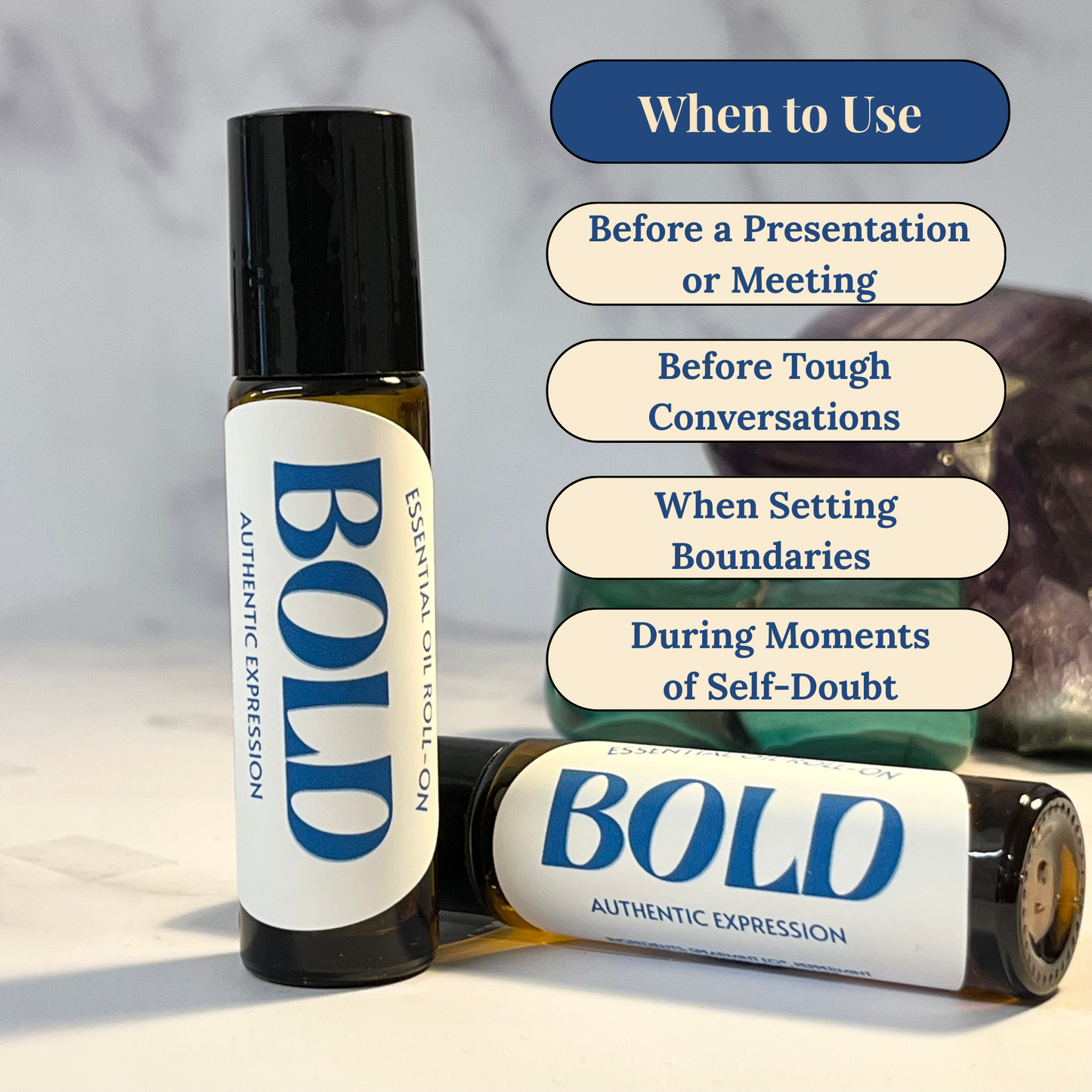 Two bottles of 'BOLD' essential oil roller on a light surface with usage tips displayed.