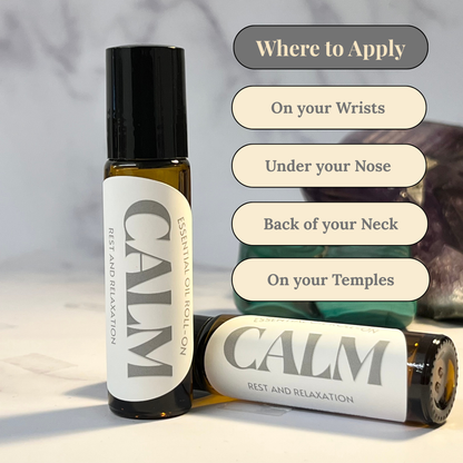 Two bottles of 'Calm' essential oil roll-ons with application instructions on a neutral background.