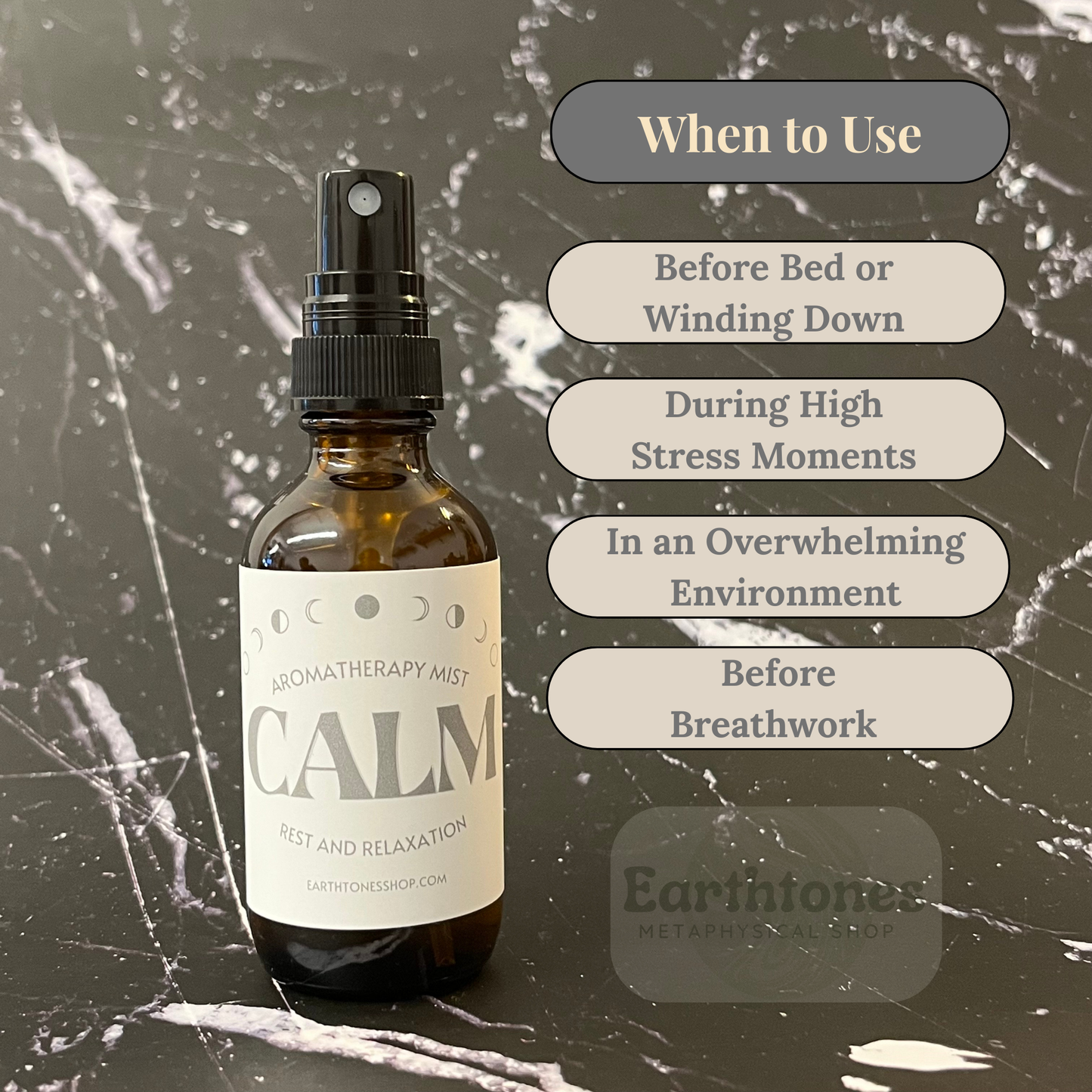 Aromatherapy mist bottle labeled 'CALM' with usage instructions on a dark marble background.