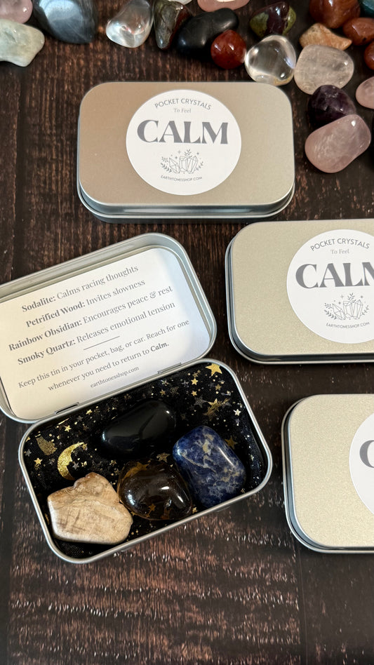 Sodalite, Petrified Wood, Rainbow obsidian, smoky quartz in tin on faux wood background 
