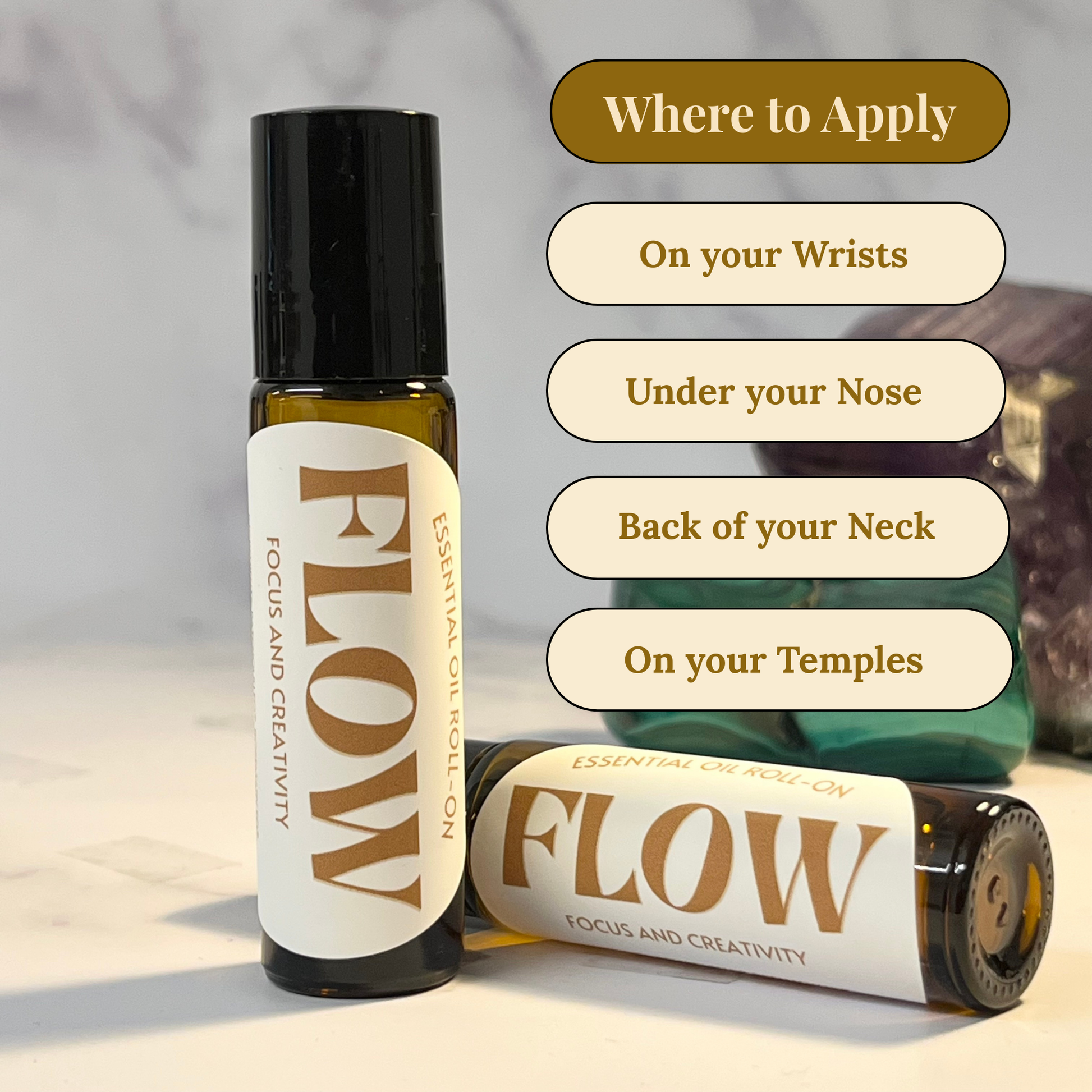 Two bottles of 'Flow' essential oil with application instructions on a neutral background
