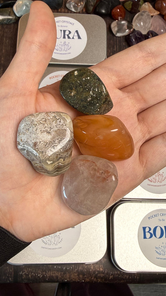 Carnelian, Fire Quartz, Crazy Lace Agate and Ocean Jasper in palm of hand 