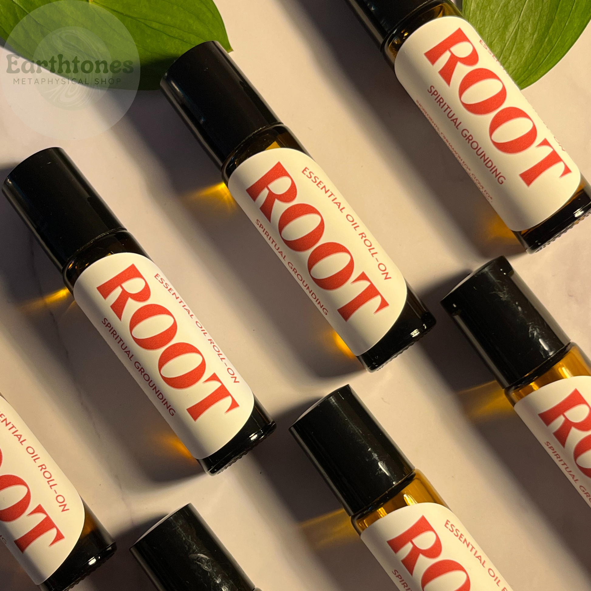 Roll-on bottles labeled 'ROOT' on a light background